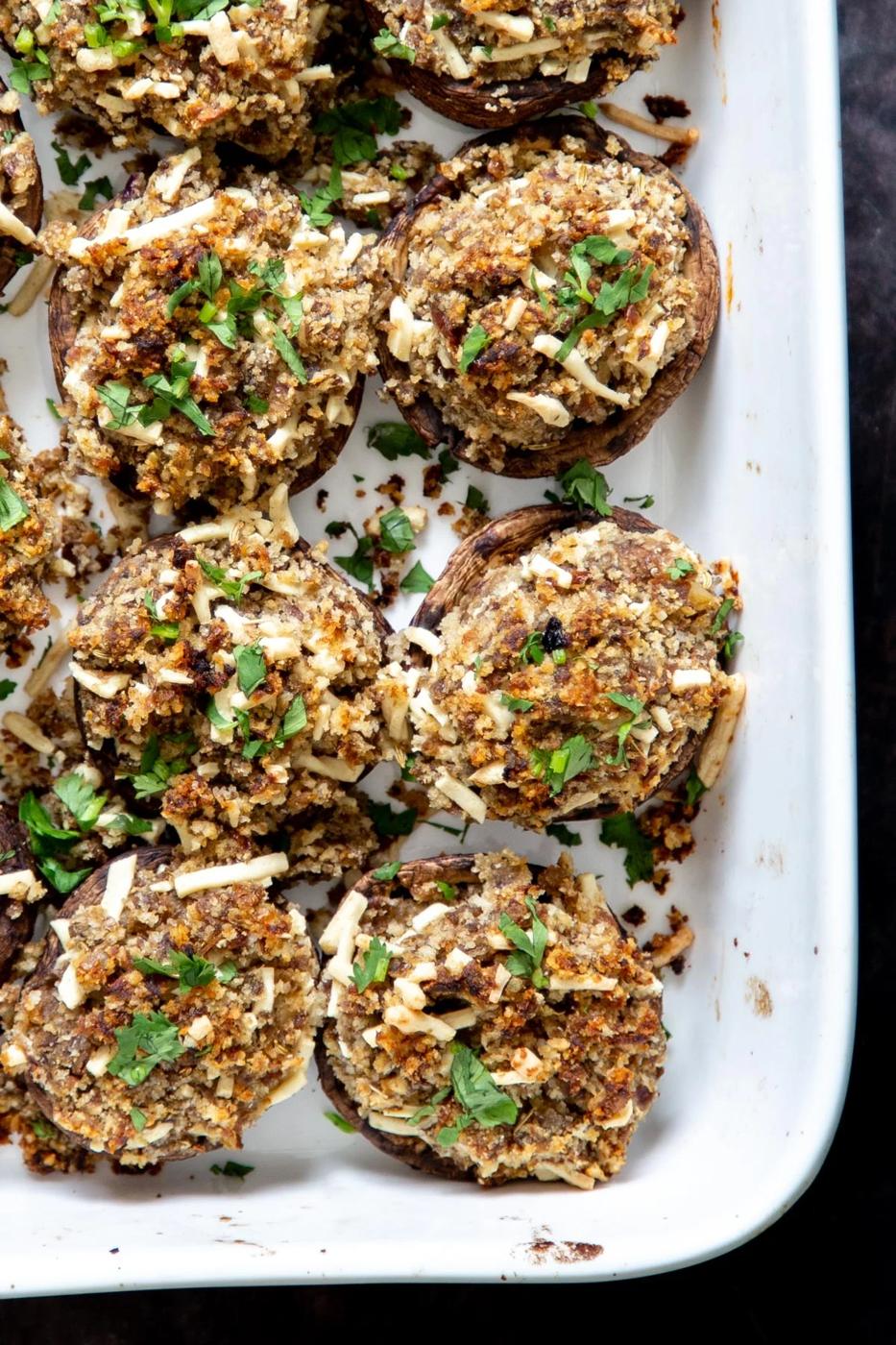 stuffed vegan mushrooms filled with breadcrumb cheese filling in a casserole dish