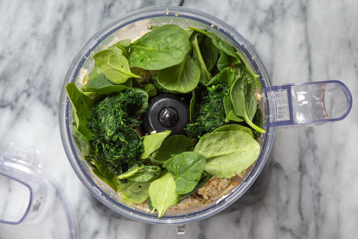 ingredients for vegan spinach ricotta filling in a food processor