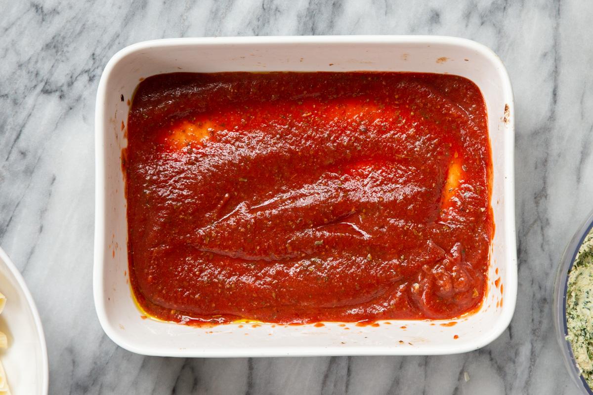 marinara sauce in a white casserole dish