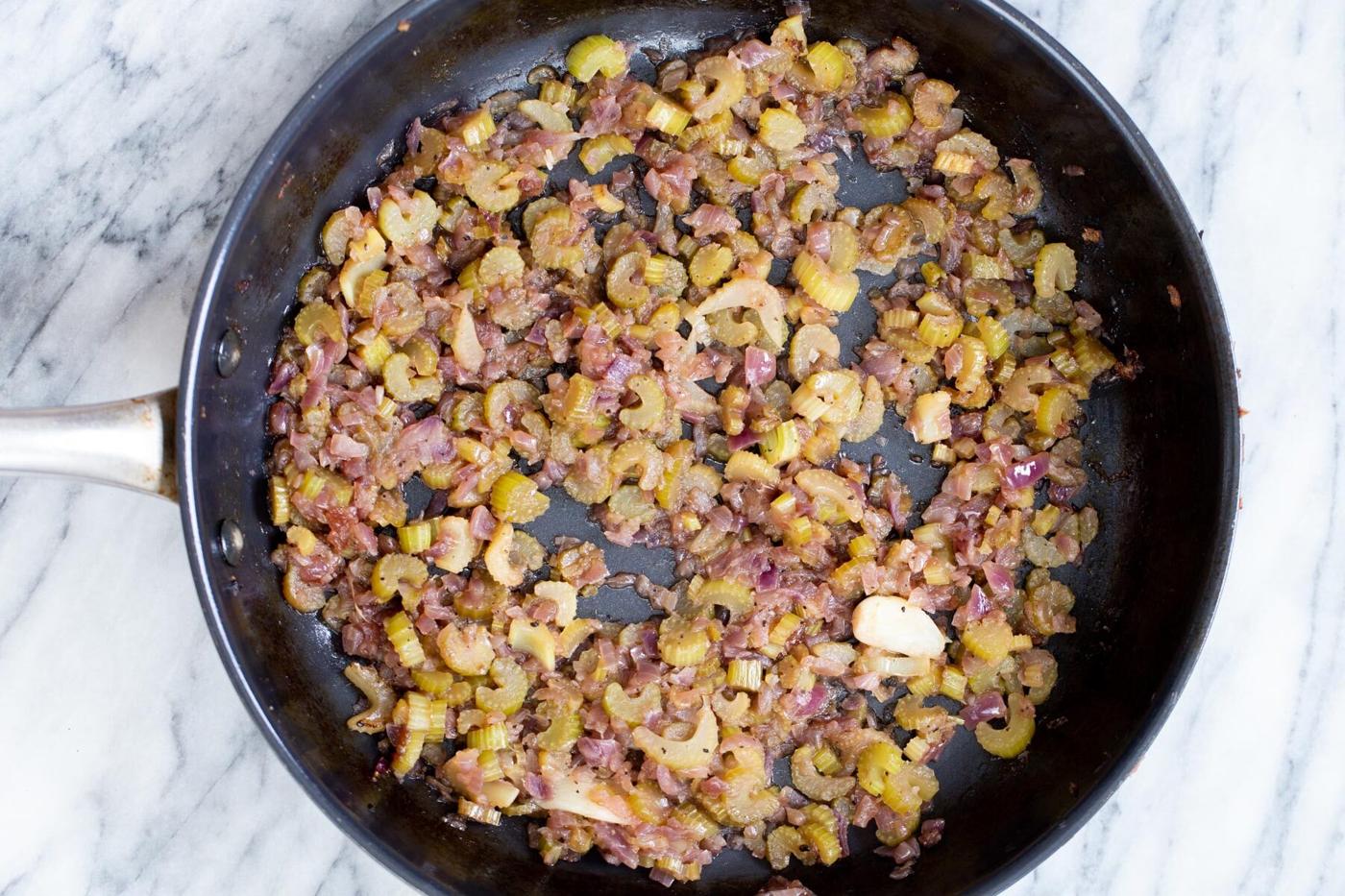 vegan stuffing in a black sauteeing pan