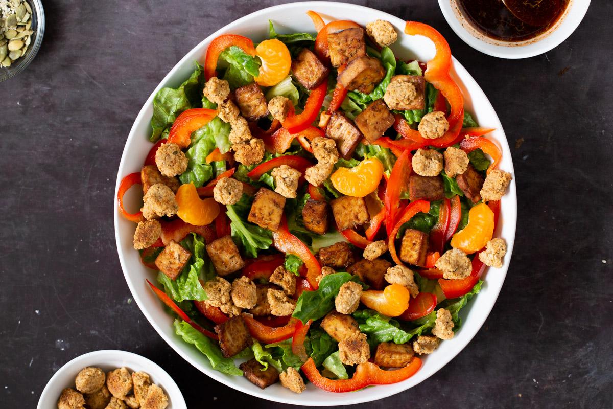 adding croutons to the salad bowl