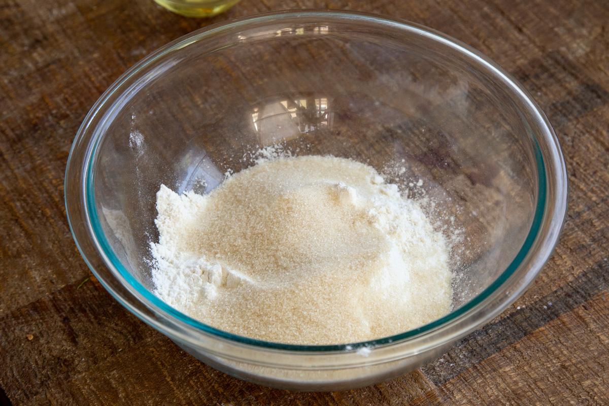 dry ingredients for vegan tiramisu sheet cake in a glass bowl