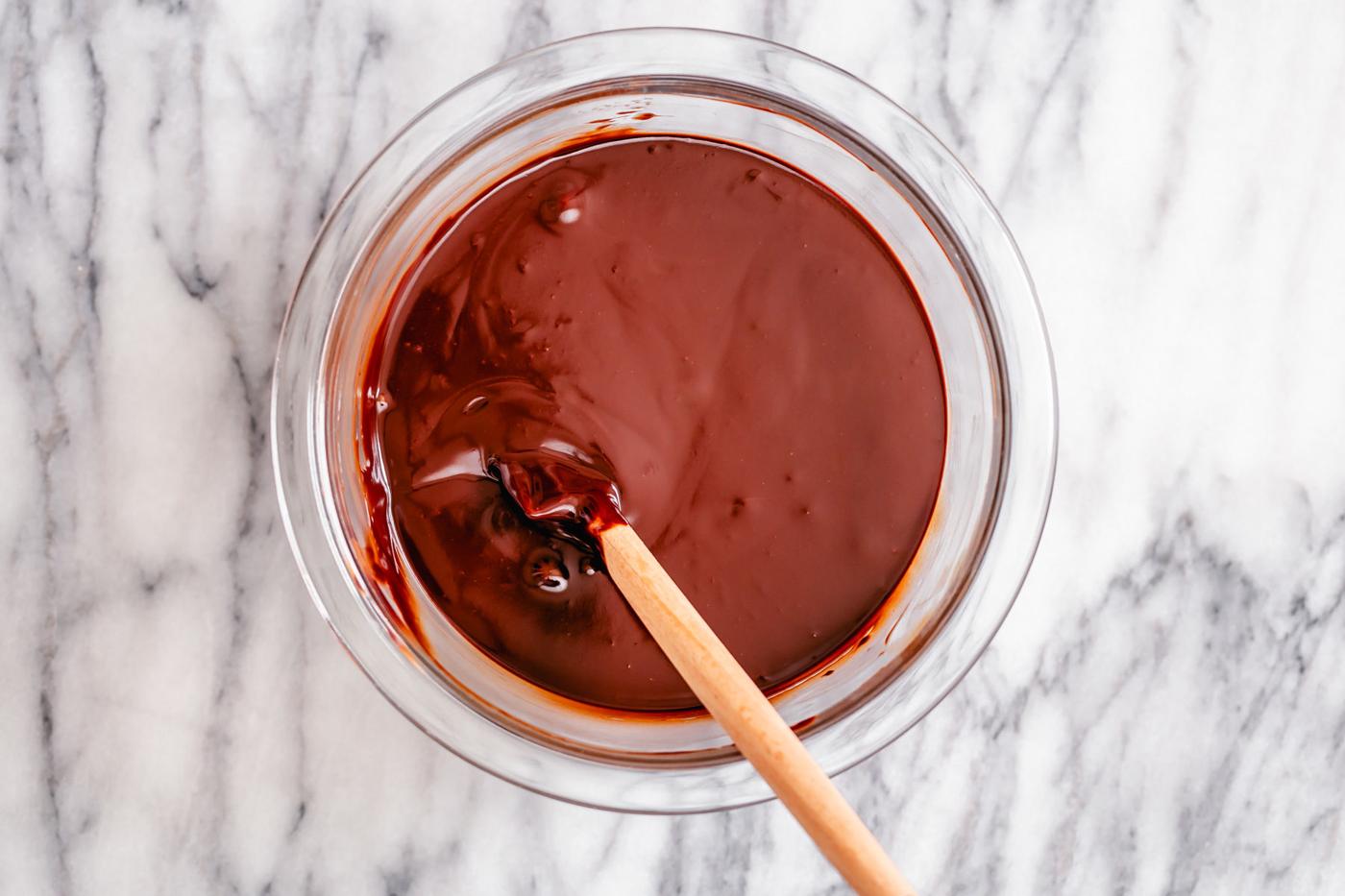 overhead shot of a bowl with melted chocolate mixture for vegan coffee truffles