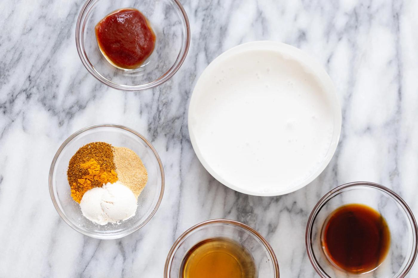 ingredients for making tofu katsu curry on a marble kitchen counter