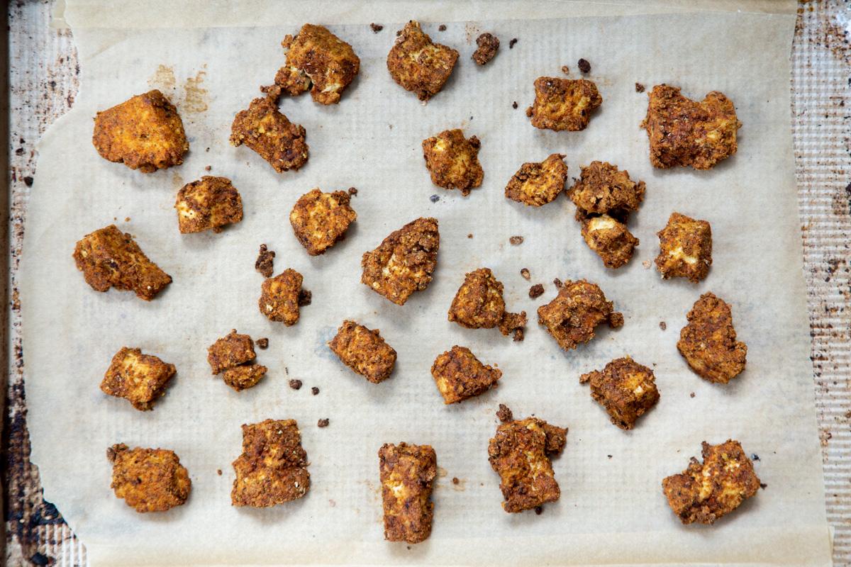 baked tofu nuggets on a sheet pan
