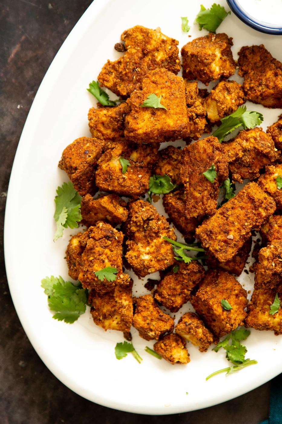a platter with baked cripsy tofu nuggets