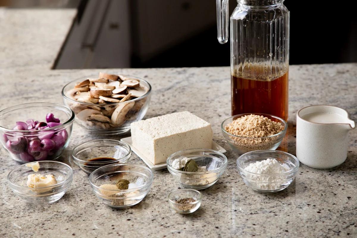 mushroom gravy and tofu schnitzel ingredients on a kitchen counter
