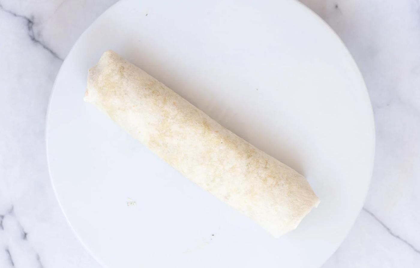 Vegan Tortilla Roll Ups assembled and Rolled up, ready to be sliced