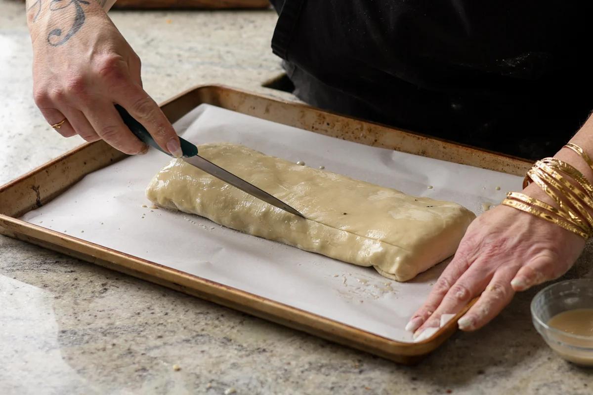 slicing vents into the puff pastry with a knife