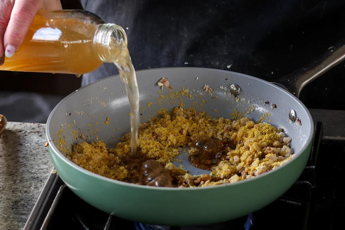 adding stock to the gravy