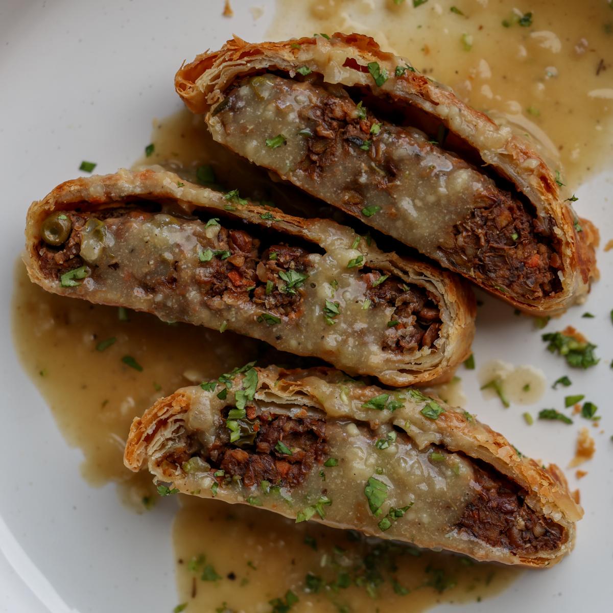 lentil wellington on a plate with gravy