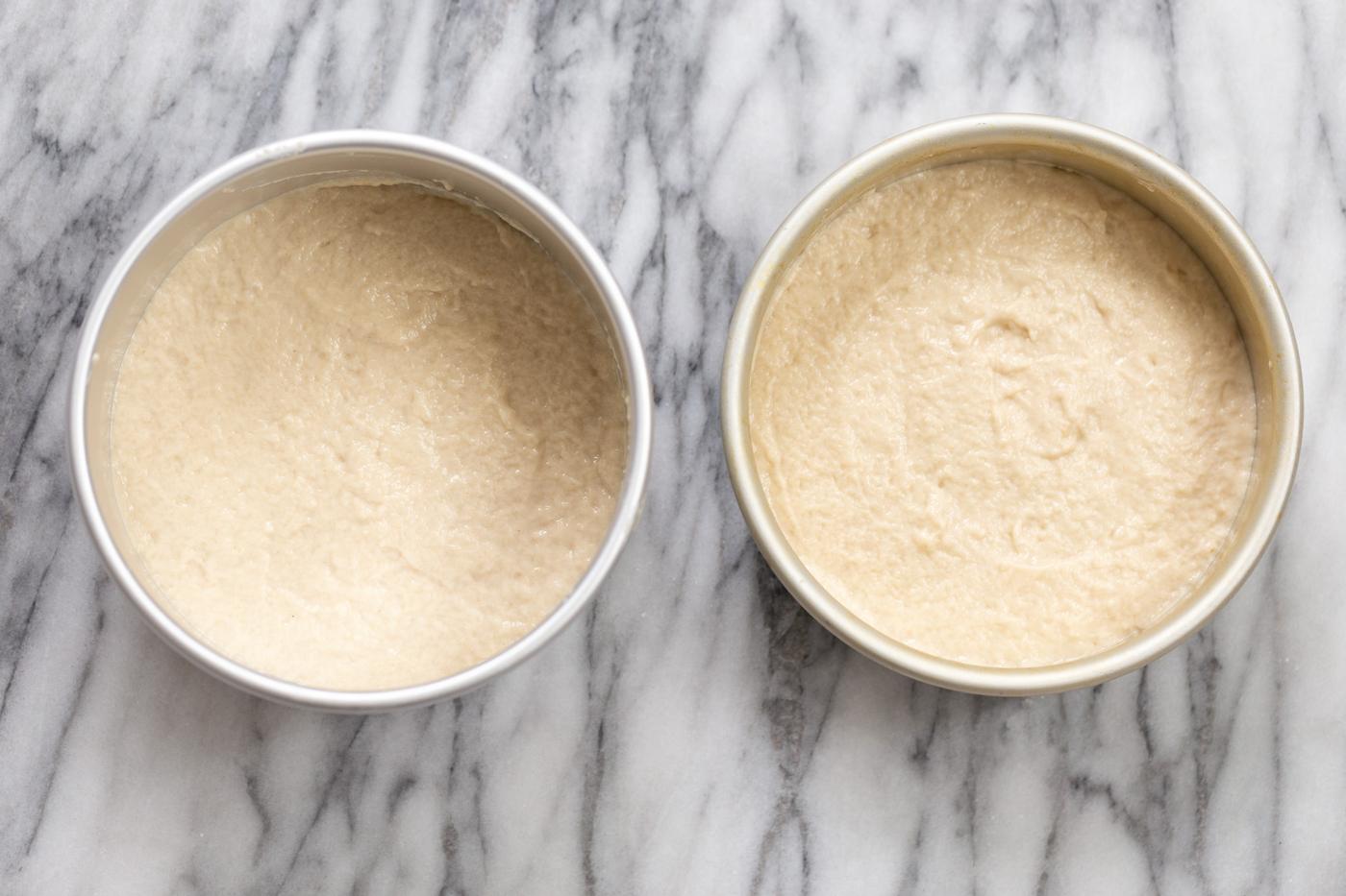 vegan white cake batter in two springform pans