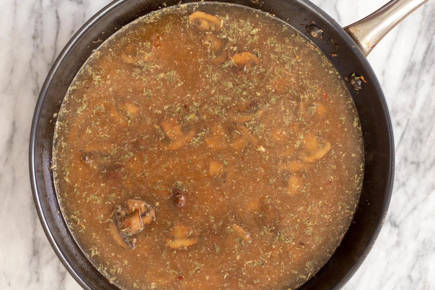 mushroom broth in a skillet