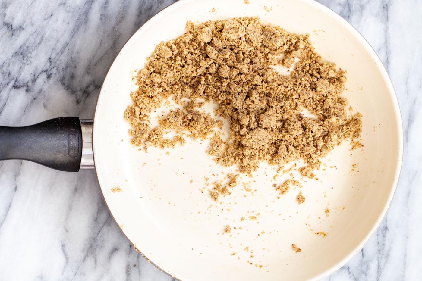 dry mix for ladoo in a sauteeing pan