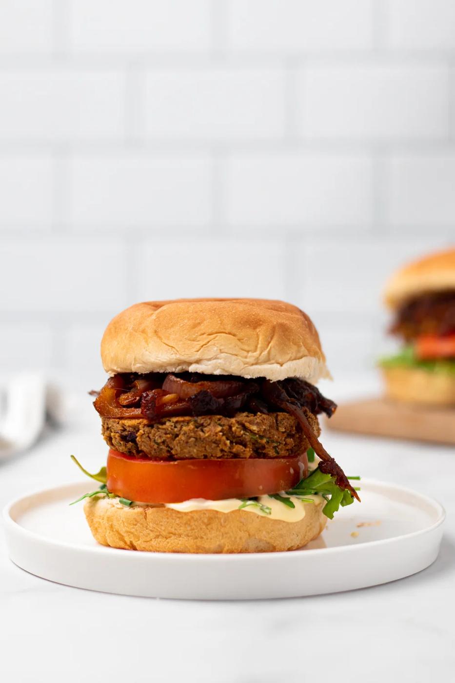 a vegan za'atar spiced chickpea burger on a white plate