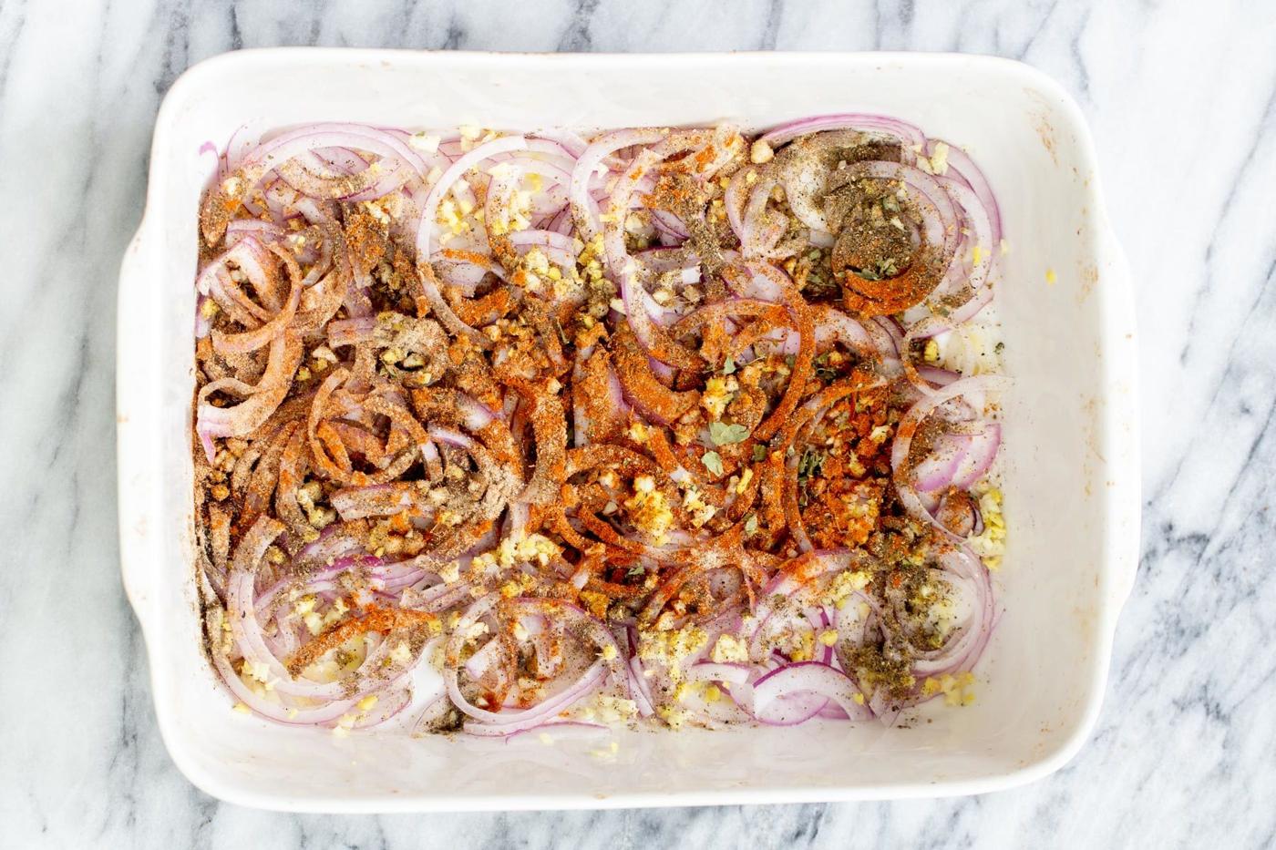onions, garlic and ginger in a casserole dish