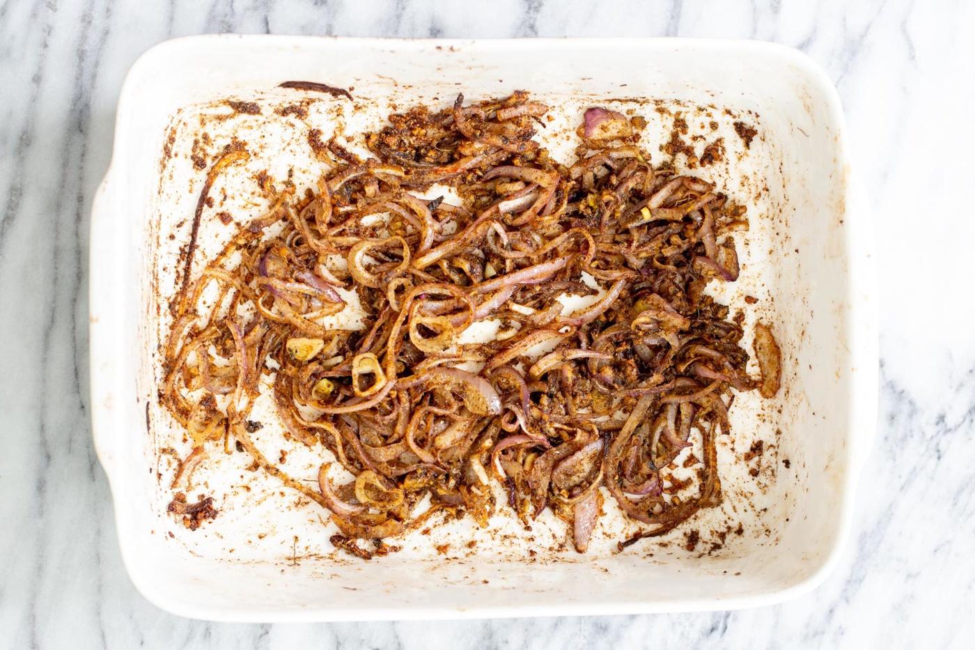 onion, garlic and ginger tossed and baked with spices and oil to make balti