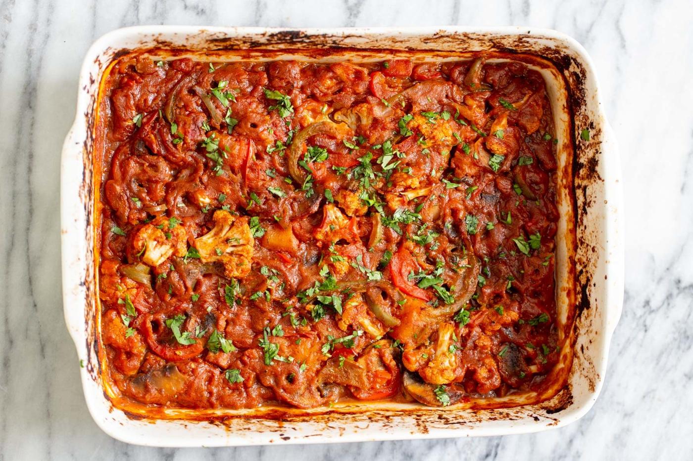 freshly baked Indian vegetable balti in a white casserole dish