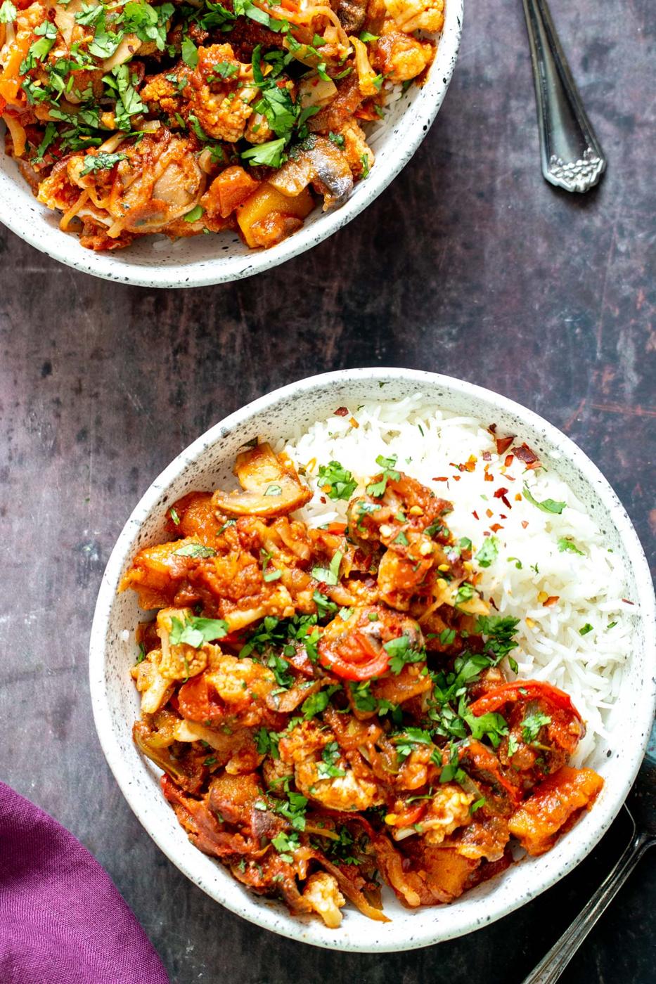 two bowls of healthy vegetable balti with rice