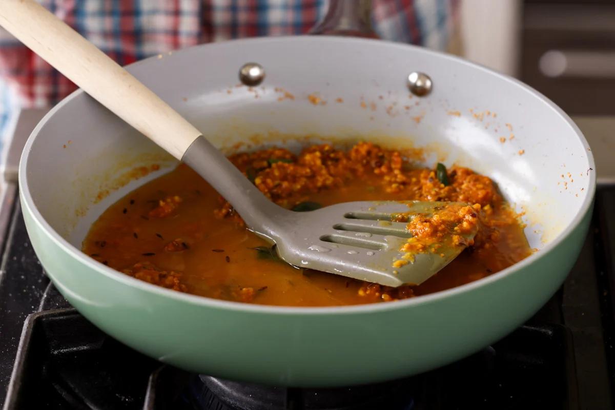 adding a little water to the chickpea flour mixture