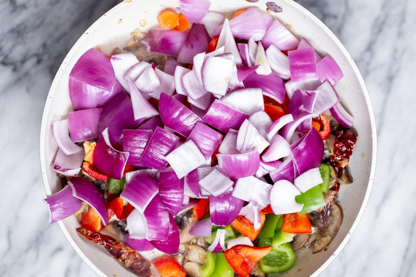 chopped vegetables in a frying pan