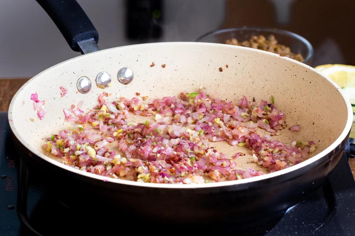 sauteed onion with ginger and chili in a sauteeing pan