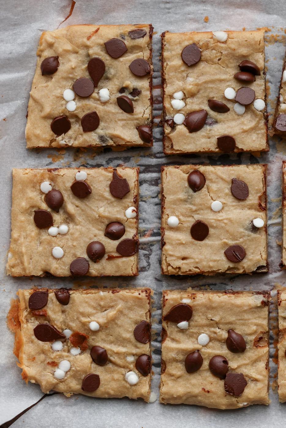 sliced white bean blondies on parchment paper