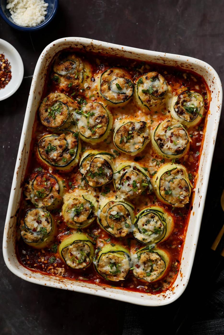 zucchini rolls in the baking dish after baking
