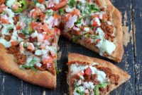 Vegan Mexican Pizza with Chipotle Refried Beans, Fresh Pico de Gallo, and Zesty Lime Crema on a Wheat Sorghum Crust