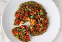 Garden Glory Pizza: Chickpea Quinoa Chard Crust with Roasted Cauliflower & Burst Tomatoes
