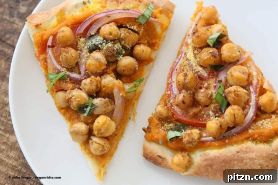 Golden Harvest Chickpea Pumpkin Pizza 5 Overhead view of a freshly baked Chickpea Pumpkin Veggie Pizza, perfectly golden with vibrant toppings and ready for serving.