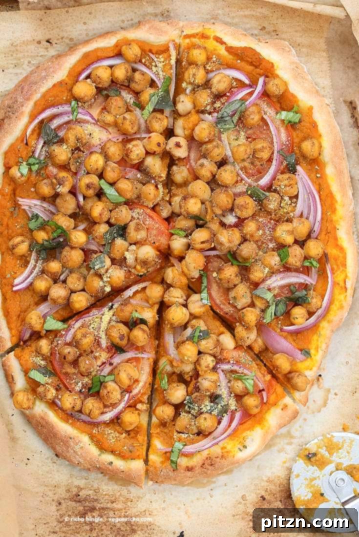 Golden Harvest Chickpea Pumpkin Pizza 7 A beautifully plated slice of Chickpea Pumpkin Veggie Pizza, showing the texture of the crust and toppings.