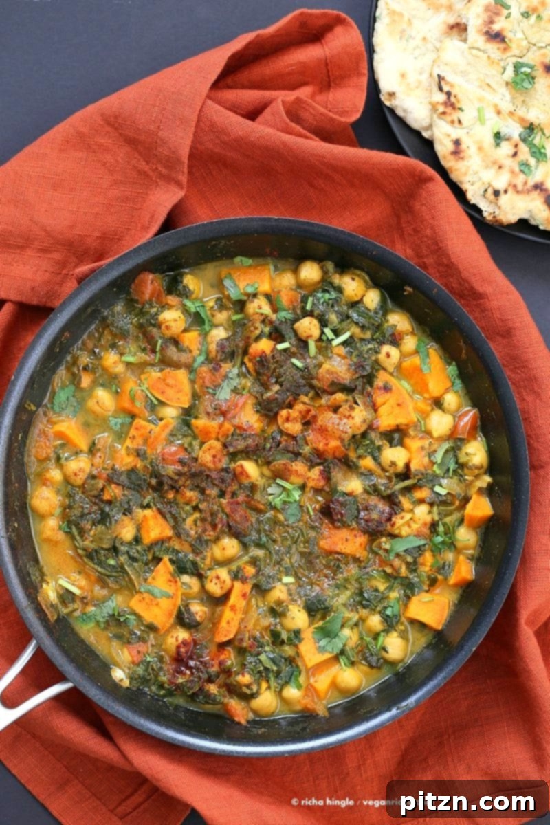 Hearty One-Pot Chickpea Sweet Potato Spinach Curry 3 A close-up of the bubbling One-Pot Chickpea, Sweet Potato, and Spinach Curry, showcasing the rich texture and vibrant ingredients, ready to be enjoyed. A perfect vegan, gluten-free, soy-free meal.