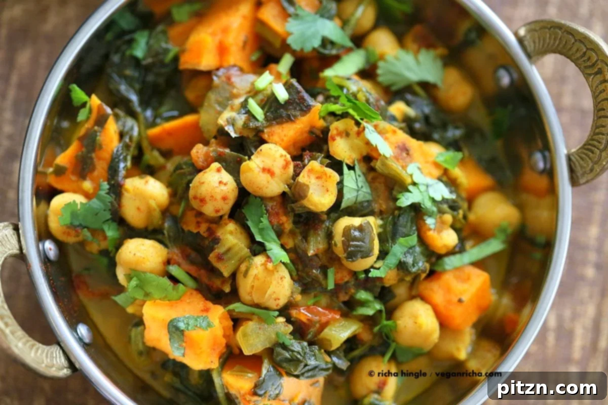 Hearty One-Pot Chickpea Sweet Potato Spinach Curry 4 A close-up shot of the finished One-Pot Chickpea, Sweet Potato, and Spinach Curry in a serving bowl, perfectly plated and ready to be enjoyed. A truly delicious vegan, gluten-free, and soy-free meal.