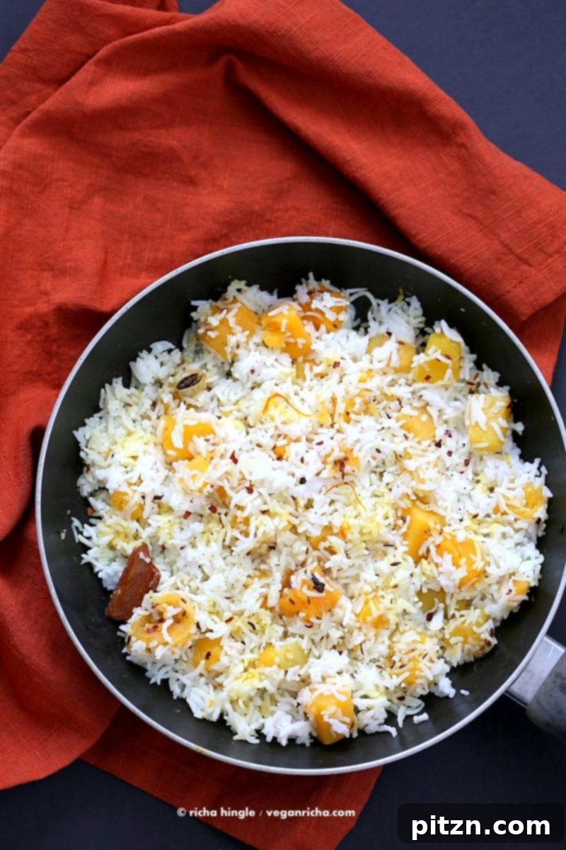 Golden Butternut Pilaf with Warming Spices 4 Close-up of Butternut Squash Pilaf with Whole Spices. Features cardamom, cloves, and cinnamon. Ideal for vegan and gluten-free holiday meals. | VeganRicha.com #Vegan #Glutenfree #Holiday #side #Recipe