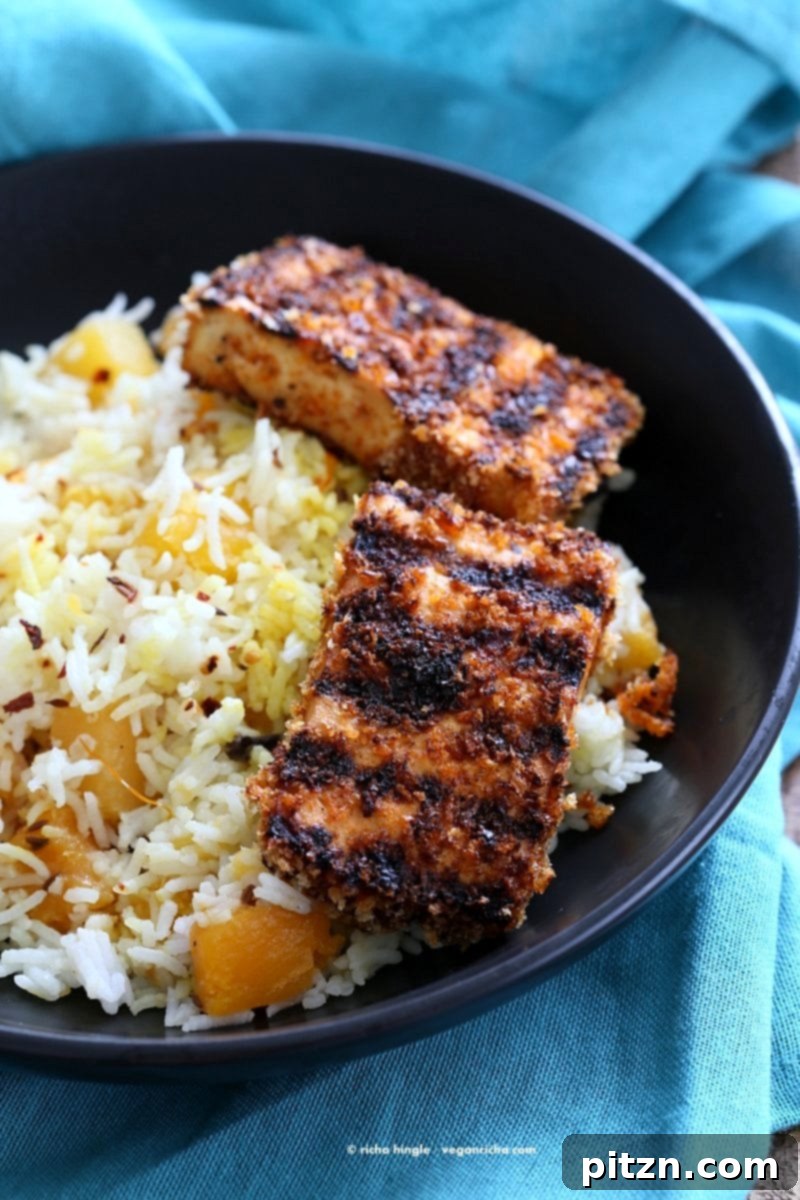 Spicy Crispy Breaded Tofu Strips, golden brown and ready to serve, a flavorful and easy vegan dish.