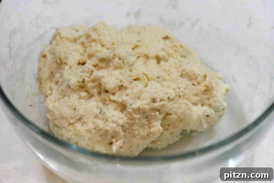 Mixing the dough for easy yeast-free dinner rolls. A soft, slightly sticky vegan dough ready for baking.