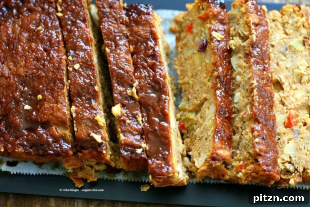 Delicious Plant-Based Chickpea Meatloaf 5 A perfectly baked Chickpea Veggie Loaf, golden brown with a spicy BBQ glaze, ready to be sliced and served for a vegan Thanksgiving dinner.