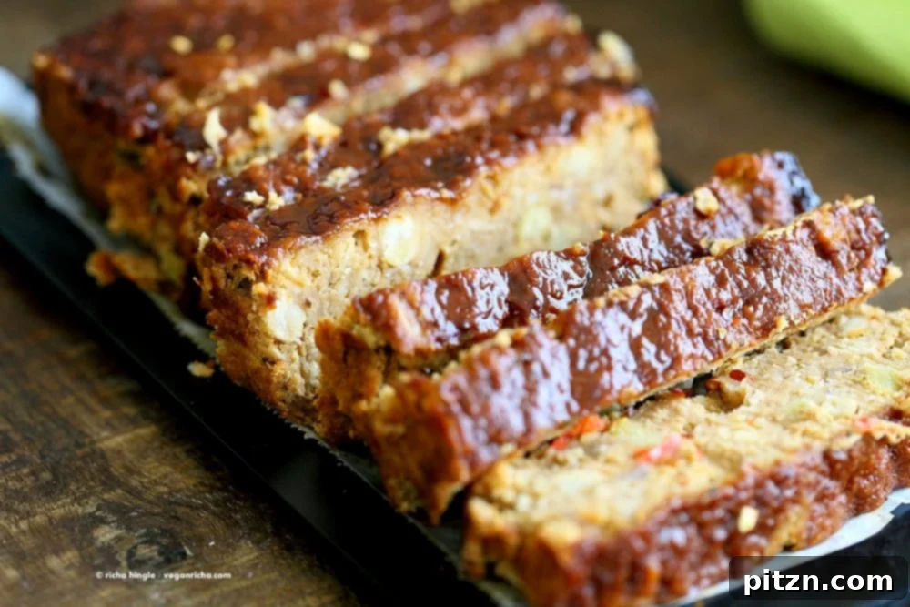 Delicious Plant-Based Chickpea Meatloaf 8 Sliced Chickpea Veggie Loaf cooling on a wire rack, revealing its hearty interior and ready to be served with delicious sides.
