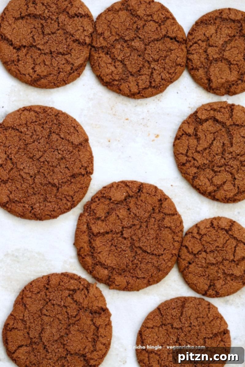 Giant Molasses Cookies cooling on a wire rack. Vegan Ginger molasses cookies. Huge, chewy and Crinkles! Easy #Holiday #Christmas #Cookie #Recipe.| VeganRicha.com