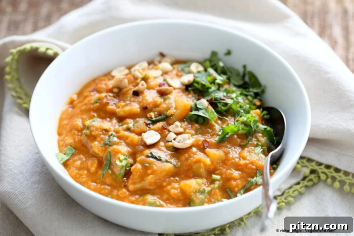 Hearty West African Peanut Lentil Soup 4 Delicious African Peanut Lentil Soup, perfect for a warming meal, shown with fresh cilantro garnish.