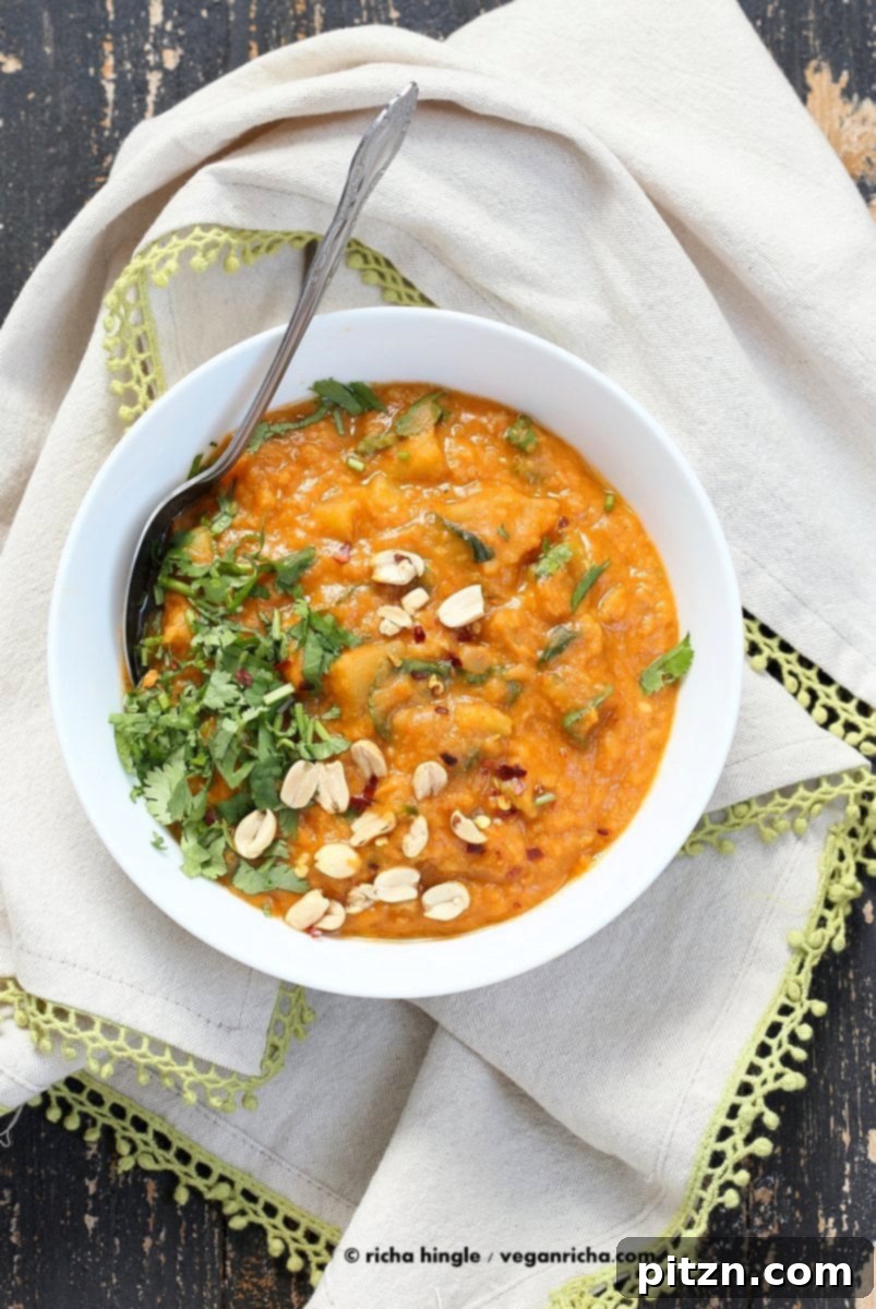 Hearty West African Peanut Lentil Soup 5 Close-up of West African Peanut Lentil Soup, showcasing its thick, creamy texture and colorful vegetables.