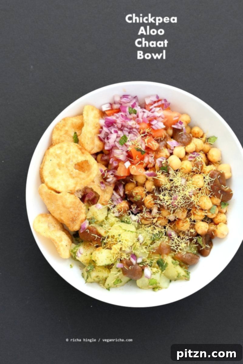 Zesty Chickpea Potato Chaat Bowl with Date Tamarind Drizzle 5 The final presentation of the Chickpea Aloo Chaat Bowl, highlighting its appealing layers and fresh components. A delectable and healthy vegan, gluten-free, soy-free, nut-free Indian dish perfect for any occasion. | VeganRicha.com #vegan #glutenfree #bowl #recipe