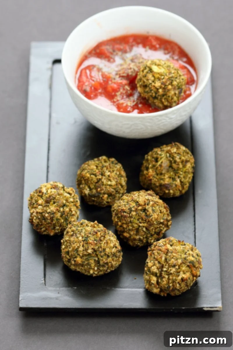 Final presentation of Vegan Broccoli Balls, crispy and golden, ideal as veggie 'meatballs' or an appetizer. This easy, gluten-free friendly vegan recipe is a healthy meal option. #vegan #recipe