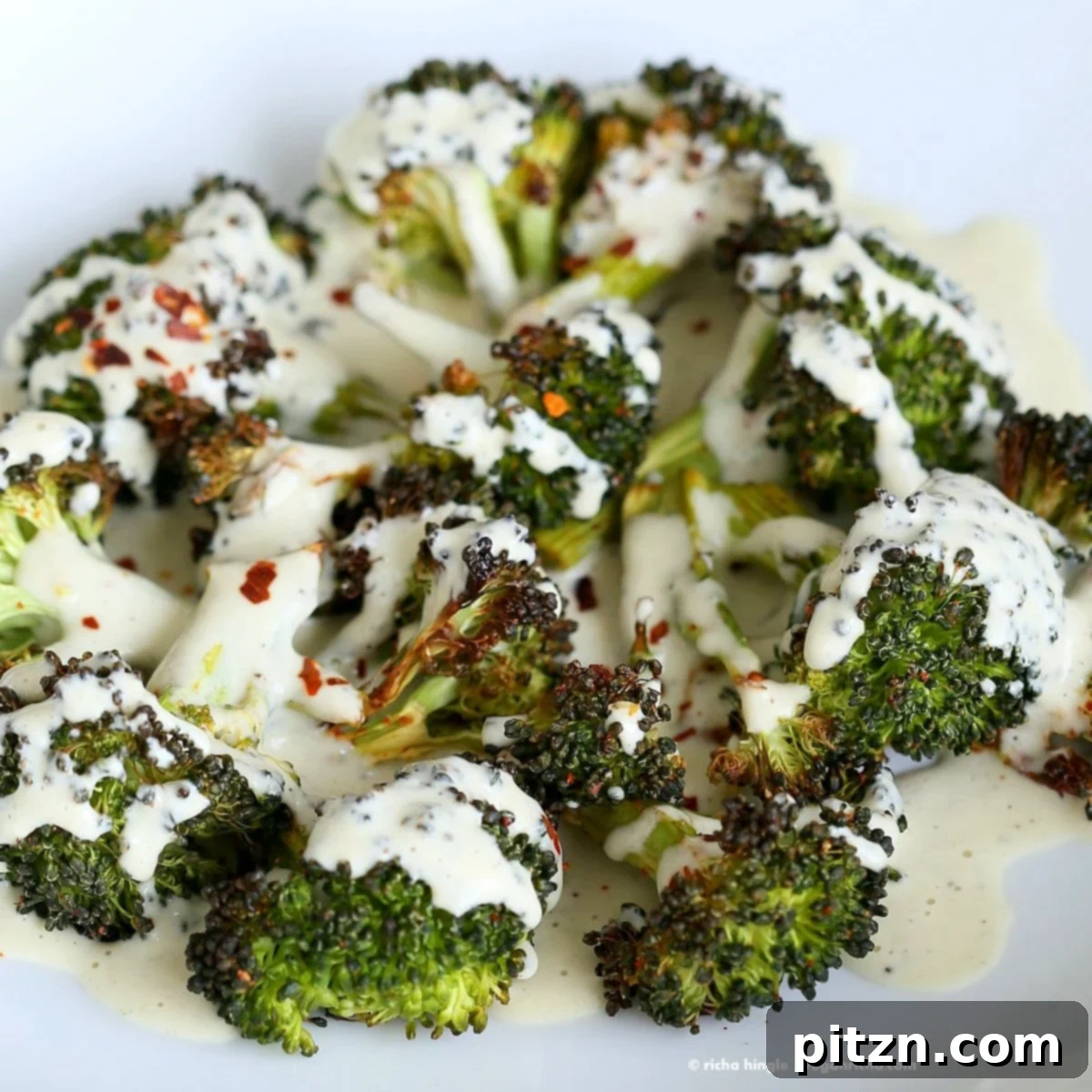 Crispy Roasted Broccoli with Zesty Basil Cream 3 Roasted Broccoli with Creamy Basil Dressing. Broccoli tossed in garlic, cayenne, and baked. Served with cheesy cashew basil sauce. Vegan Glutenfree soyfree Recipe | VeganRicha.com