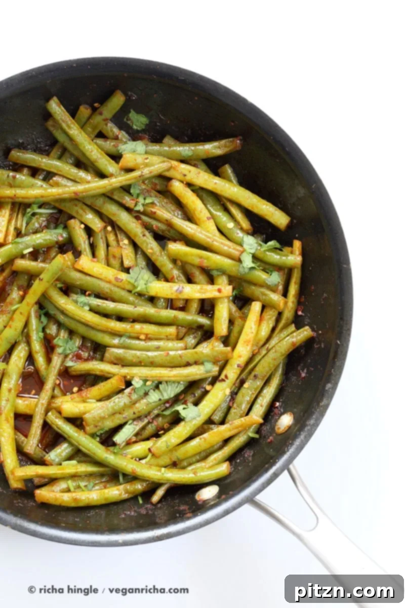 Red Curry Green Beans - Green Beans Stir fry with red curry paste, kaffir lime, sugar and chile. Phad Phrik Khing #Vegan #Glutenfree #Soyfree #Recipe | VeganRicha.com