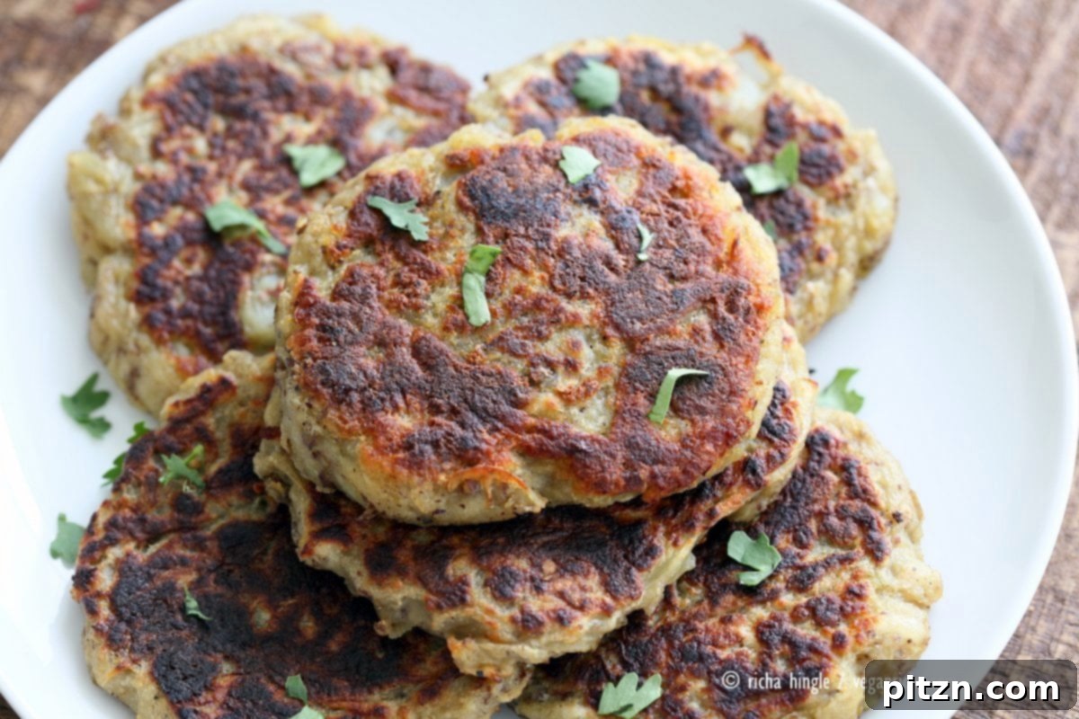 Boxty Irish Potato Cakes with Avocado Basil Ranch 3 A close-up of a plate of Traditional Vegan Irish Boxty Potato Pancakes with fresh herbs, ready to be served with avocado basil garlic ranch dressing. This vegan and soy-free recipe is perfect for any meal.