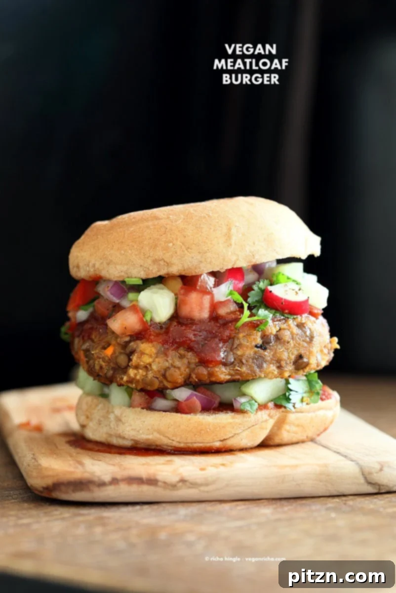 Homestyle Lentil Quinoa Burgers 5 A delicious Lentil Quinoa Meatloaf Burger served on a bun with fresh toppings, alongside a vibrant chopped salad. A perfect vegan and nut-free meal. VeganRicha.com
