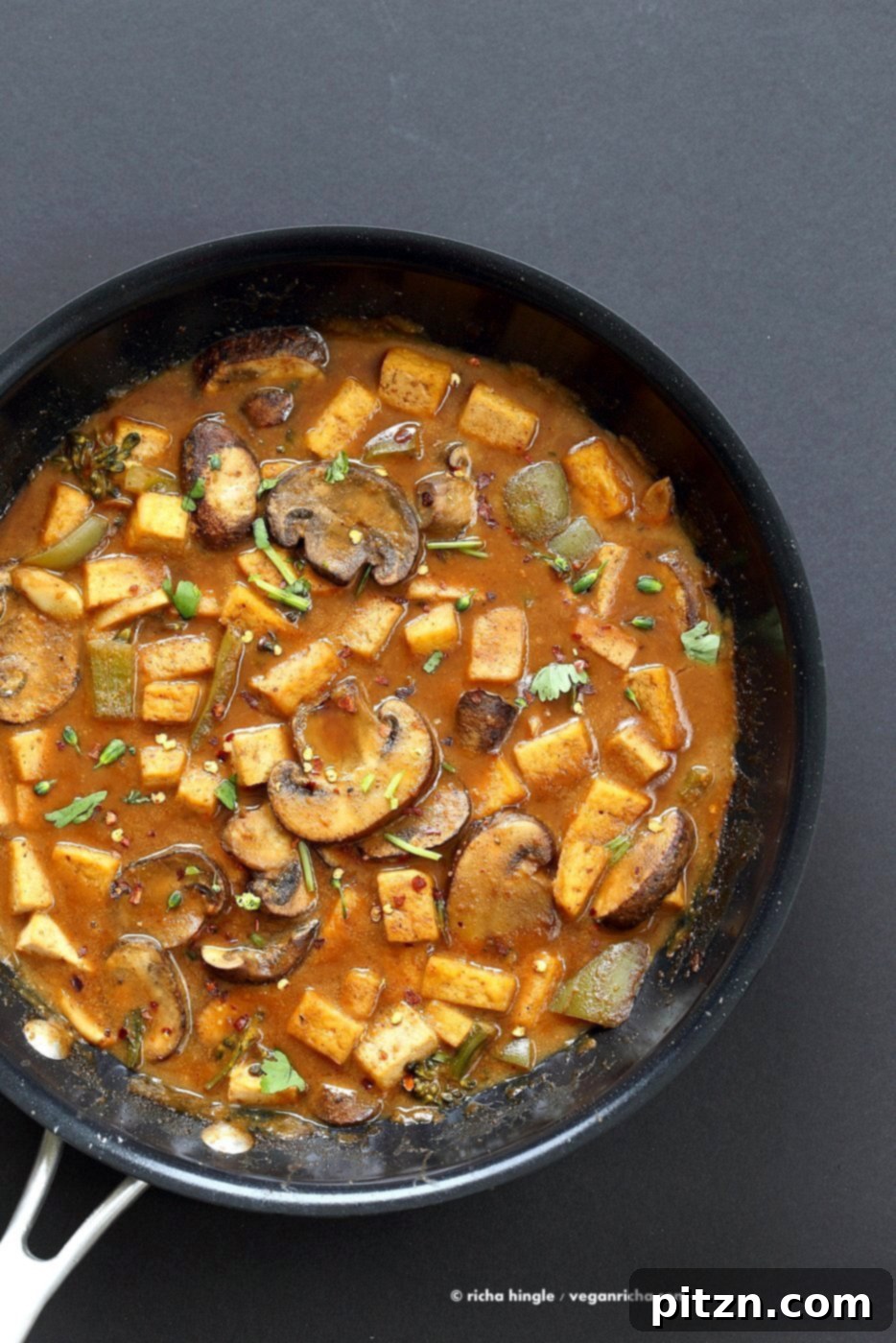 Hoisin Tofu Mushroom Stir Fry with homemade Hoisin Sauce. Easy Weeknight Meal with crisped Tofu, golden mushrooms, broccoli, peppers in from scratch Hoisin sauce. Serve over cooked grains. Vegan Gluten-free Recipe. | VeganRicha.com