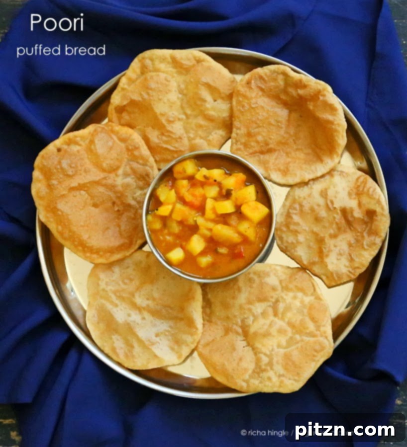 Hot, puffed Pooris served fresh with Vegan Aloo curry